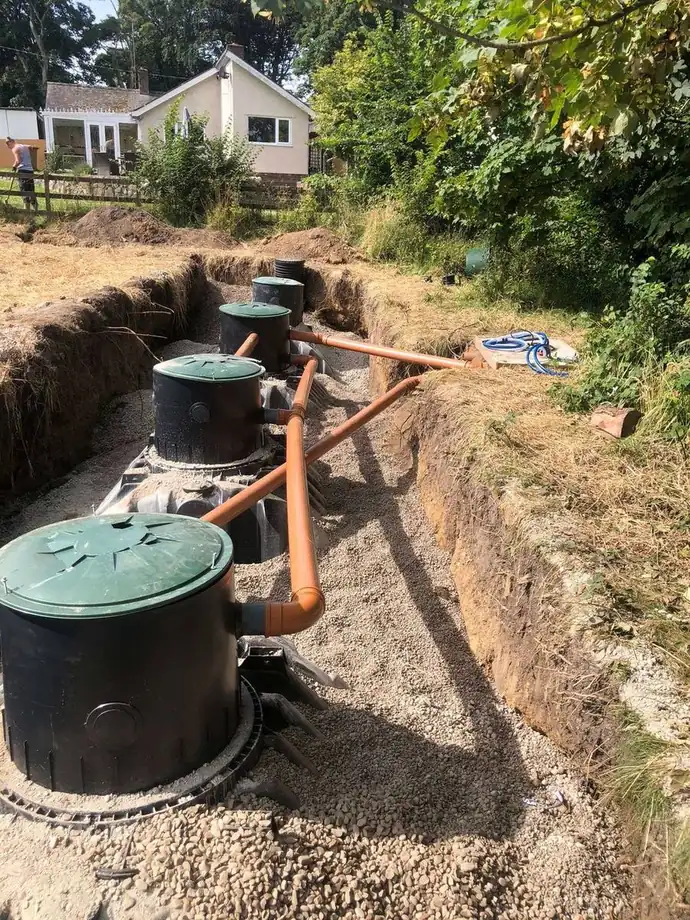Inspection chambers set in a line in an open trench