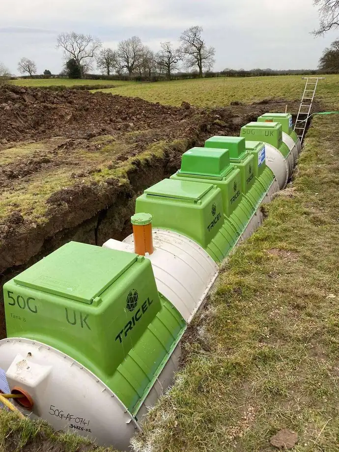 A sewage treatment plant set into a trench in a field