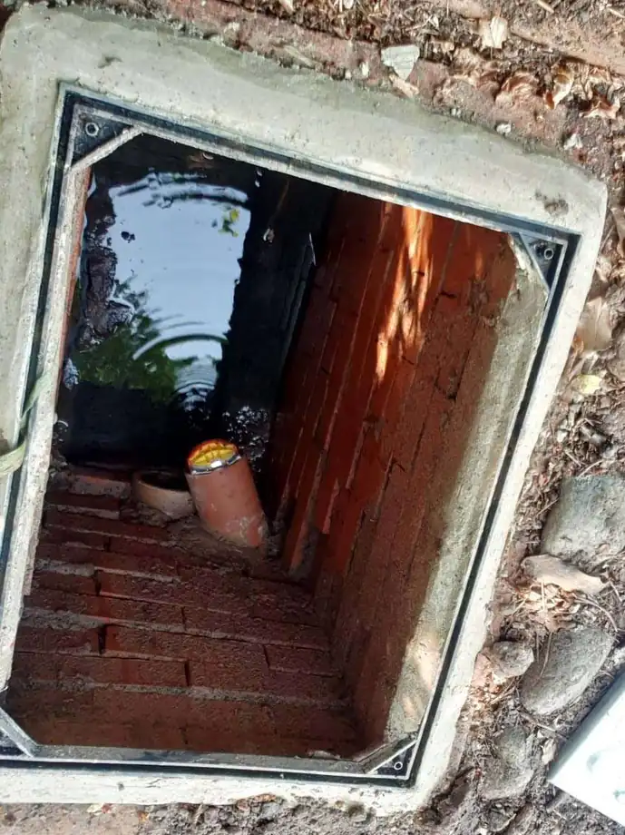 An existing brick chamber opened up for inspection